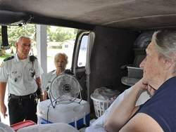 'Lady in the van' saved from fire by friend, volunteers Image